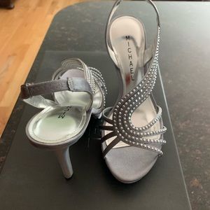 Bedazzled pewter colored dress shoes with rhinestones.